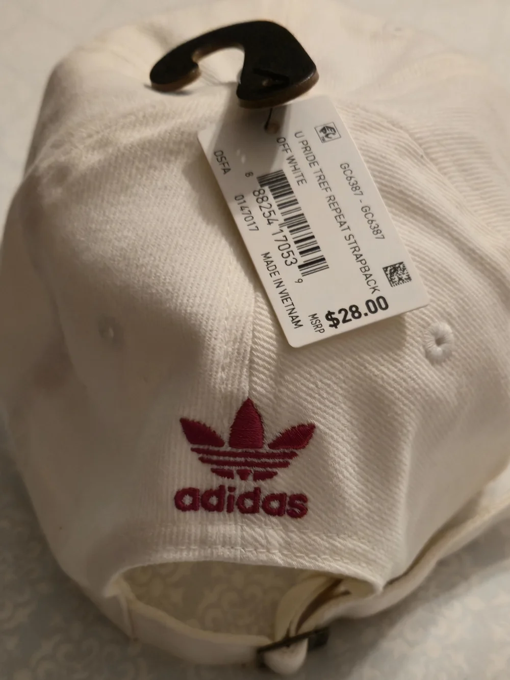 NWT Adidas Originals cap features rainbow-colored embroidered trefoil log.